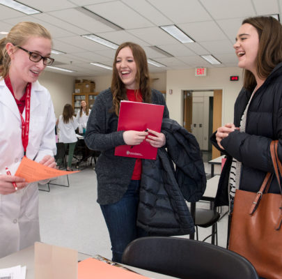 Open house attendees learn about the School of Pharmacy.