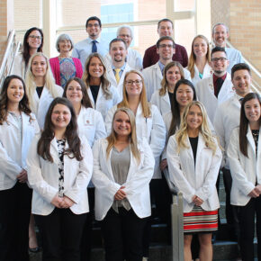 The first rural pharmacy cohort standing with their professors.
