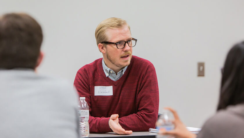 Kyle Kleinbeck speaks with students.