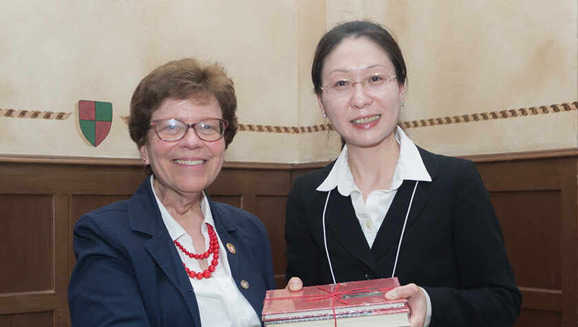 Assistant Professor Jiaoyang Jiang and Chancellor Rebecca Blank.