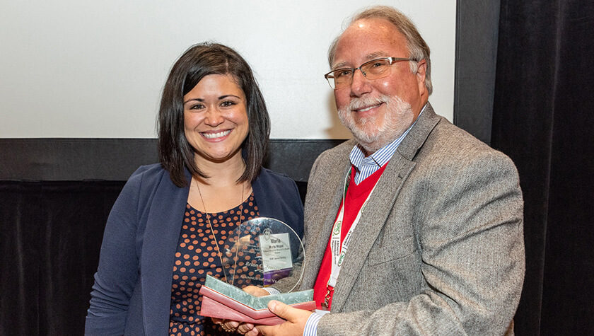 Brian Jensen holding his award with Maria Wopat