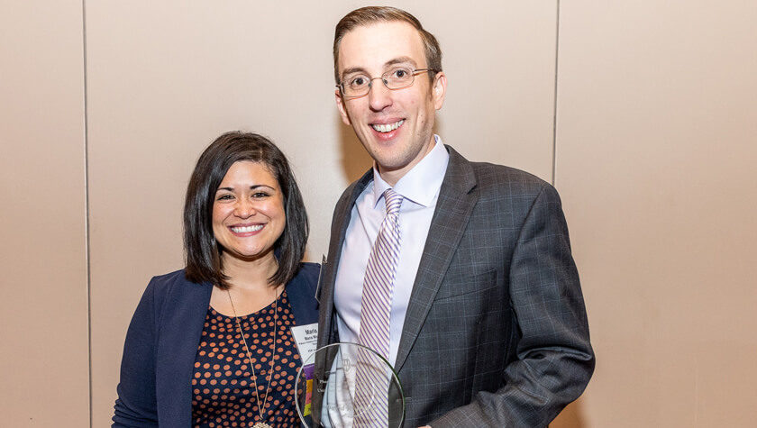 Dave Hager holding his award with Maria Wopat