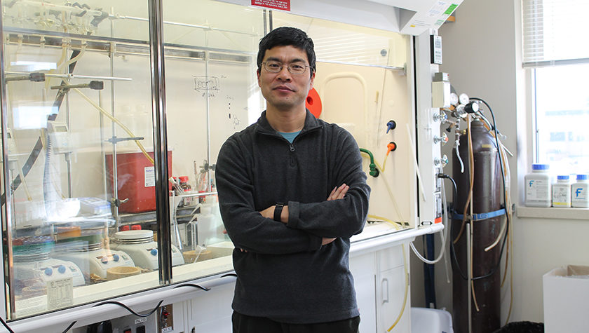 Weiping Tang in his lab at the School of Pharmacy