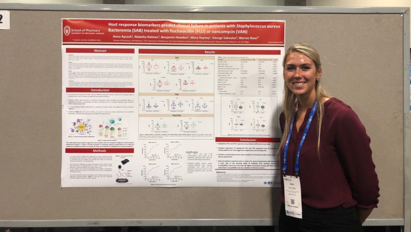 Anna Aycock and her research poster at IDWeek 2019.