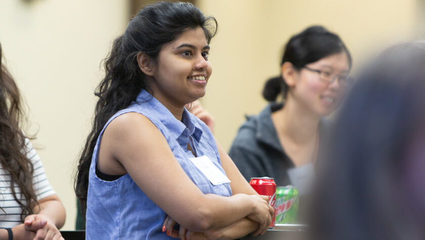 Deepika Rao, scholarship recipient, listening to speaker at event