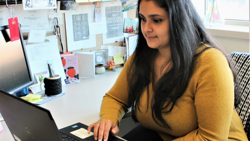 Tanvee Thakur working at her desk on laptop