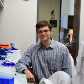Ian Miller sitting in a lab