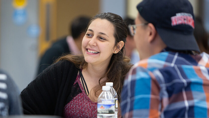 Chelsi Almodovar-Rivera smiling in a group