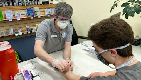 Dan Ricci conducting a TB test on a PharmD student.