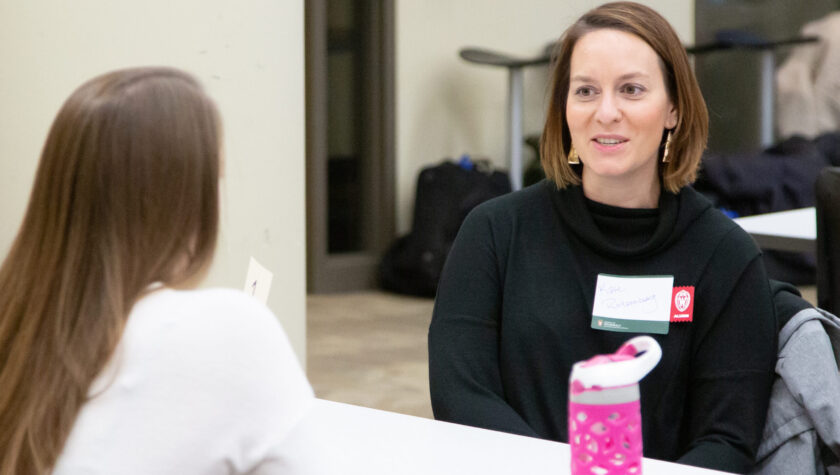 Kate Rotzenberg speaking with a student