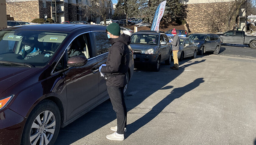 PharmD students speaking with patients in their cars.