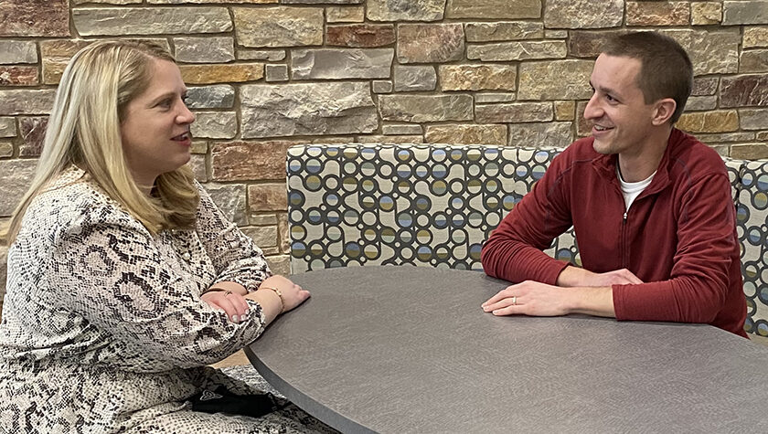 Eileen Murphy talking at a table with Brett Gadow