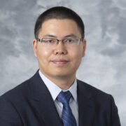 portrait of Assistant Professor Quanyin Hu, of the School of Pharmacy's Pharmaceutical Sciences Division.