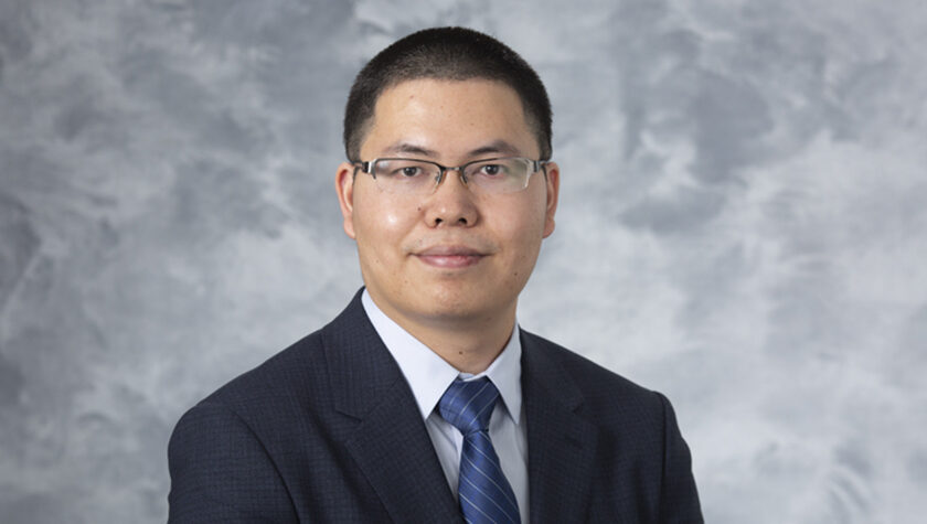 portrait of Assistant Professor Quanyin Hu, of the School of Pharmacy's Pharmaceutical Sciences Division.