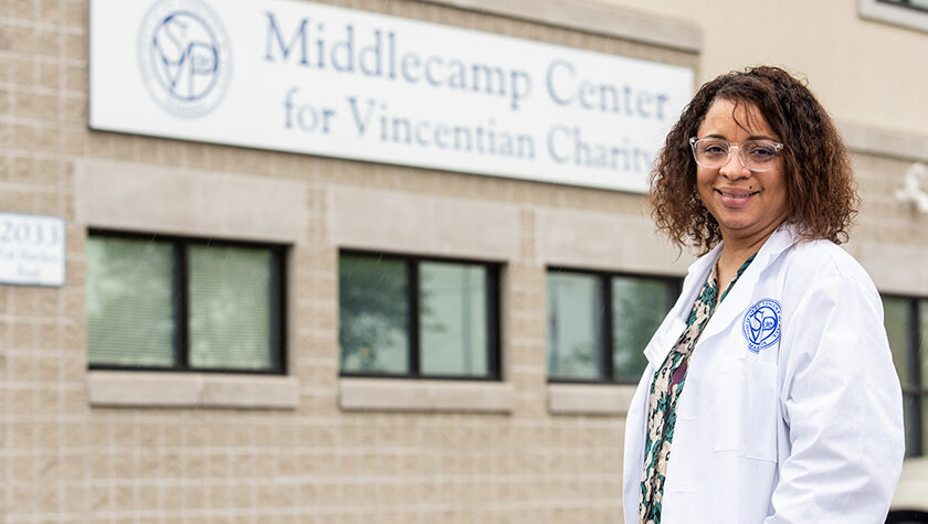 Yolanda Tolson standing out front of the Middlecamp Center for Vincentian Charity