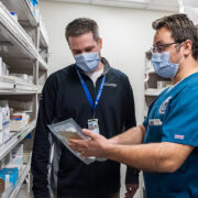 Nate Menninga and colleague in the pharmacy