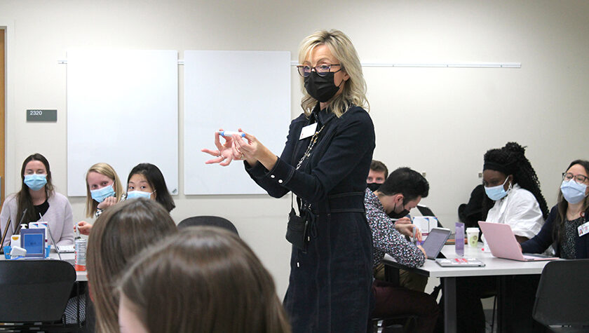 Professor Beth Martin standing in a classroom teaching students
