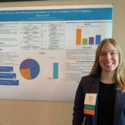 Cindy May with aresearch poster