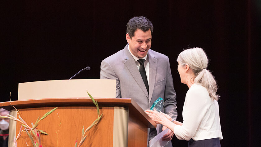 Josh Lee receives the Larry Boh Award from Professor Mara Kieser