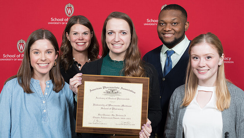 (Back row) Associate Professor Andrea Porter and PharmD student Michael Nome. (Front row) PharmD students Rachel Hawley, Brianna Groen, and Taylor Shufelt, with their award for Best National Chapter Runner-Up. | Photo by Todd Brown