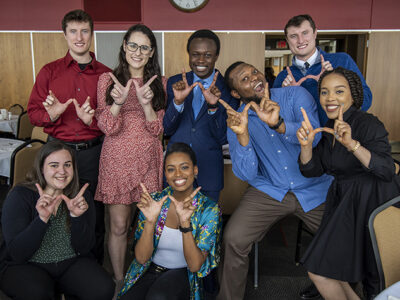 PharmD students grab a silly photo op after the 2022 School of Pharmacy Scholarship Brunch. Front row: Madeline Szubert, Maria Hill. Back row: McKay Carstens, Caroline Palay, Vincent Elijah, Michael Nome, Kane Carstens, and Mary Ann Egbujor