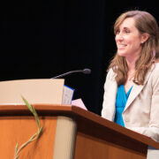 Kate Hartkopf speaks at a podium