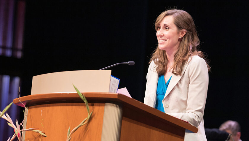 Kate Hartkopf speaks at a podium