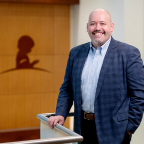 James Hoffman poses near a St. Jude logo