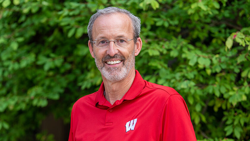 Portrait of Dave Mott in a Badger-red shirt.