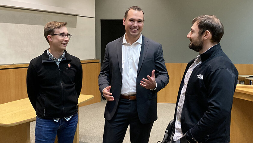 Dean Bowen speaks with two PharmD students.