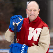 Ed Lebler holding a hockey stick