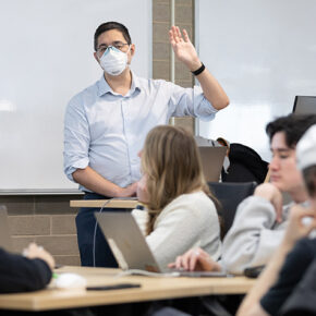 Jason Kwan gestures while teaching a class.
