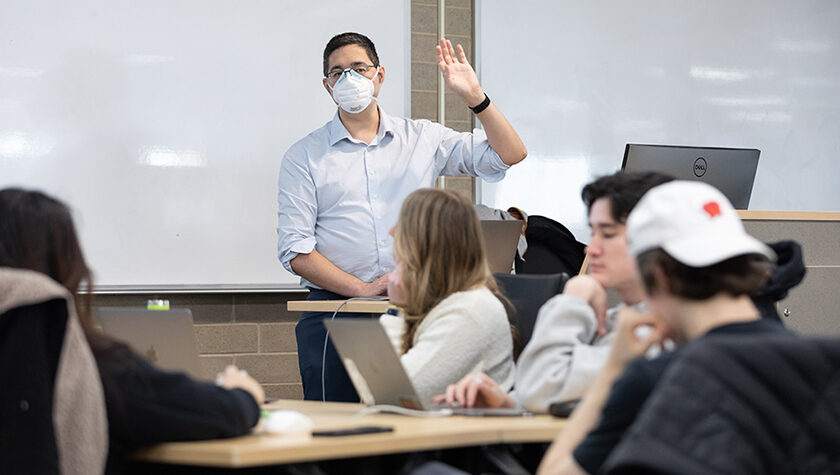 Jason Kwan gestures while teaching a class.