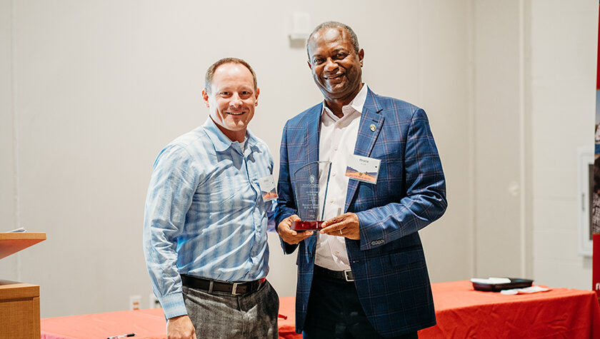 Jason Lau with Bruce Scott holding his award