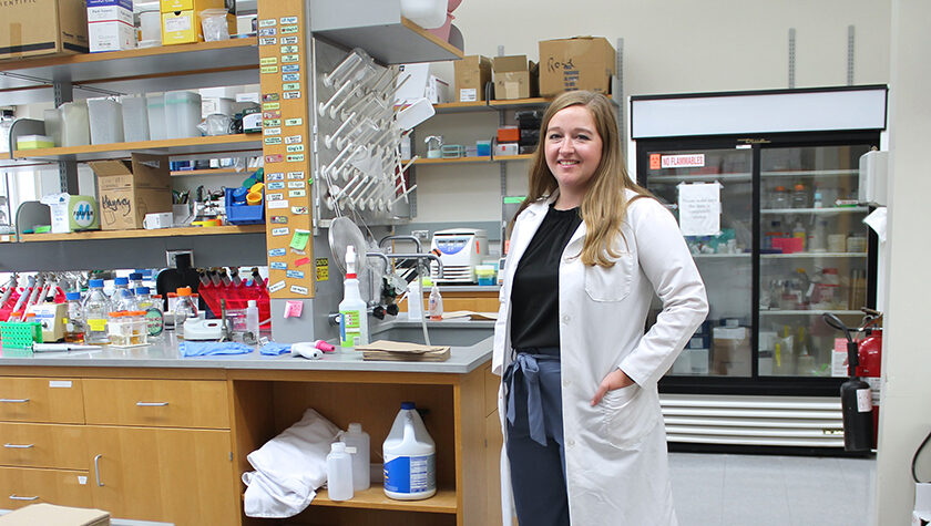 Cecilia Volk standing in a lab