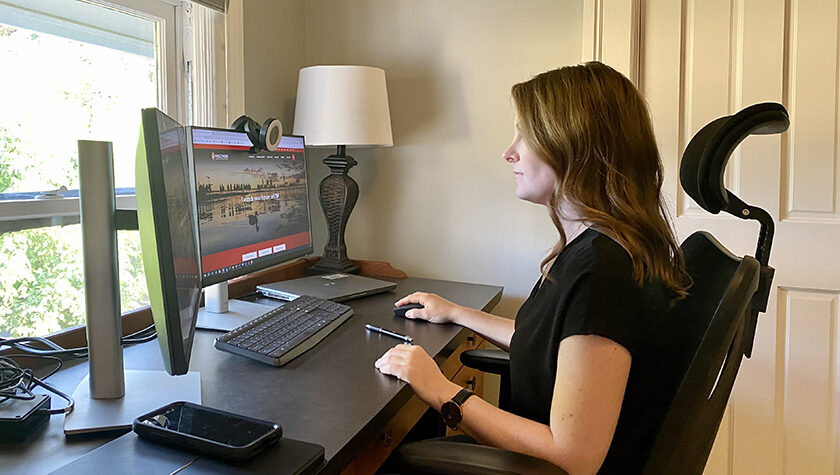 Erin Nowak works at a home computer