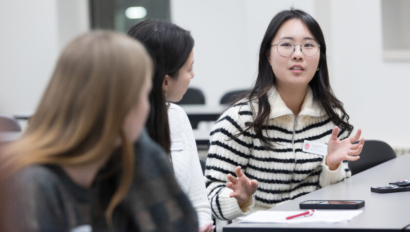 Yoonsoo Kim speaks with two other PharmD students.