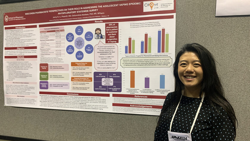 Jenny Li presents a poster at the annual APhA meeting.