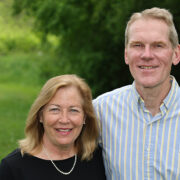 Cindy and Jim Steffen stand in a park