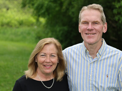 Cindy and Jim Steffen stand in a park
