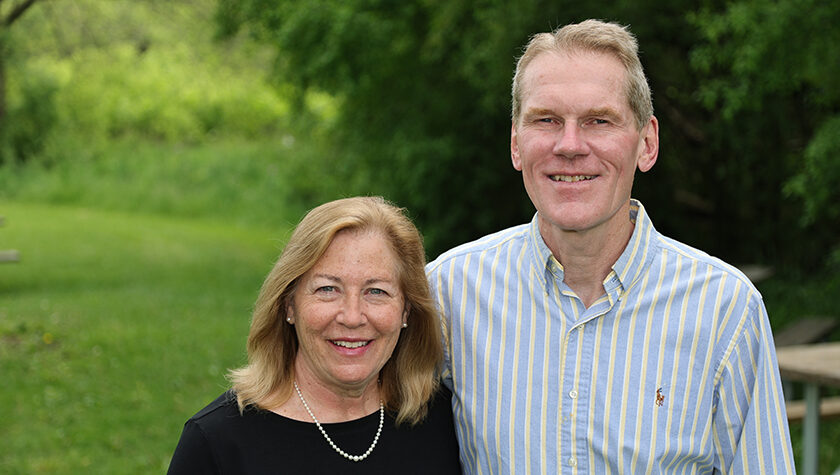 Cindy and Jim Steffen stand in a park