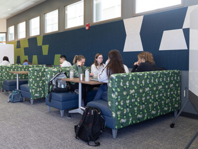 Students studying at booth-style tables