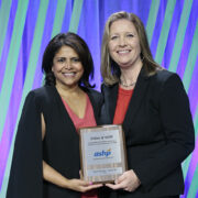 ASHP President Nishaminy (Nish) Kasbekar and Staci Hermann pose with the award plaque.