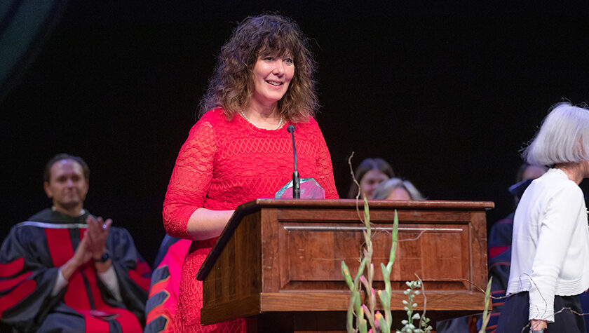 Jenny Moran speaks at a podium