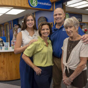 Avery, Jessica, Tim and Jana Dreier pose in the pharmacy