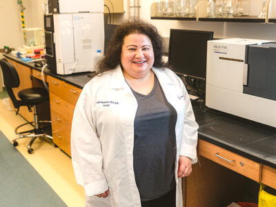 Heidi Mansour smiles in her lab