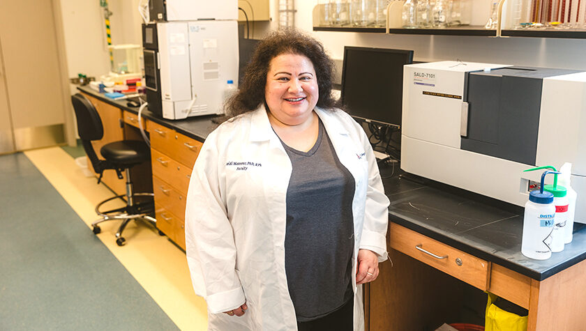 Heidi Mansour smiles in her lab