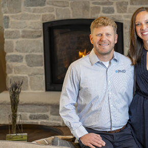 Jessica and Jesse Schaetzel pose by a fireplace