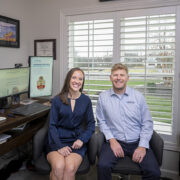 Jesse and Jessica Schaetzel pose in their home office