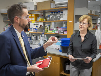 Cody Wenthur speaks with Tammy Baldwin in his lab